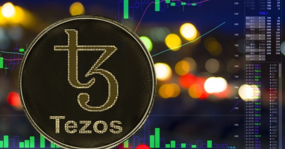 Image of Tezos coin with market candles in the background