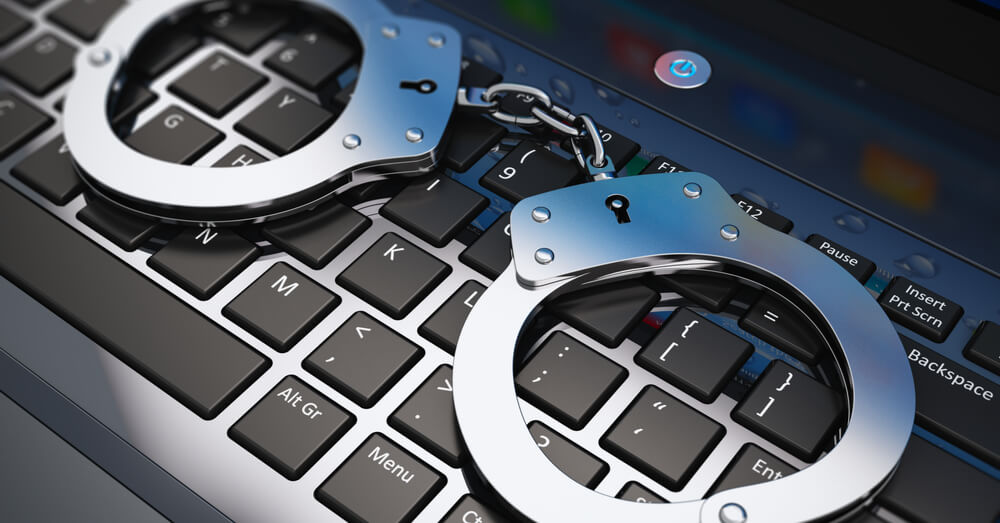 Image of handcuffs on a keyboard