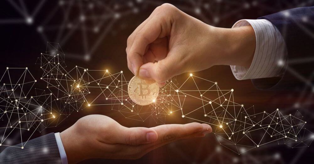 Image of a person handing someone a glowing Bitcoin