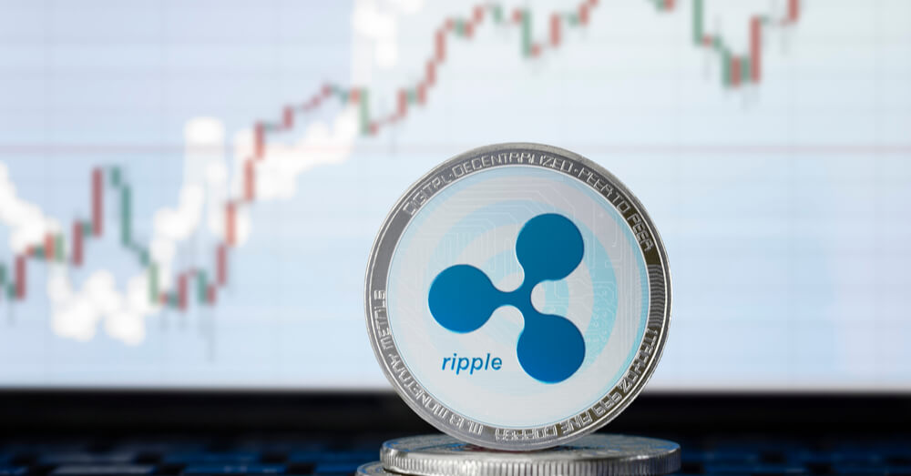 An image of Ripple coin with trading chart in the background