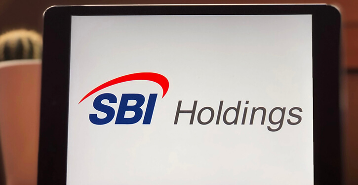 SBI Holdings company icon on a tablet screen