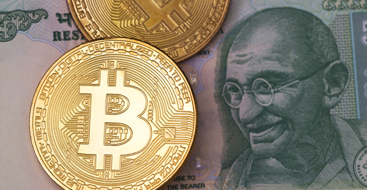 An image of Bitcoins and the symbol of justice with the Indian flag background