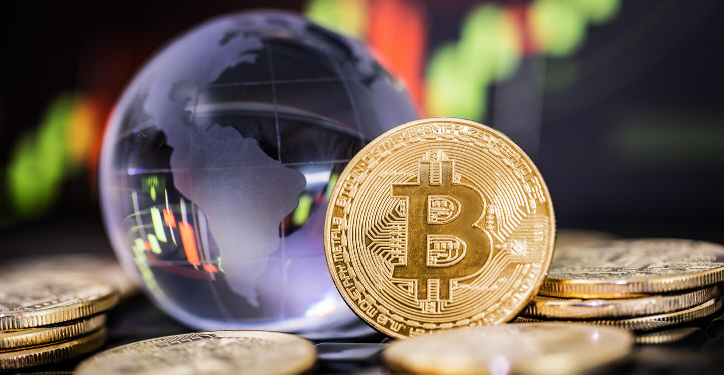 Image of globe with piles of bitcoins
