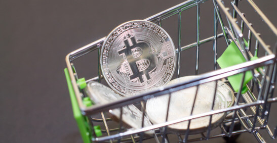 An illustration of a bitcoin in a trolley