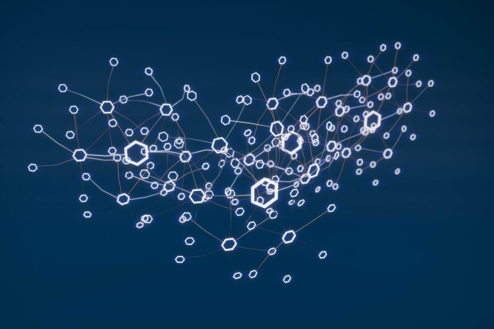A graphic representing blockchain technology. Lots of small white hexagon shapes interconnected with lines and a dark blue background