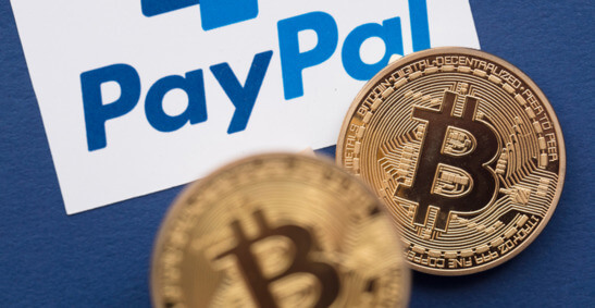 An image of bitcoins and the PayPal logo