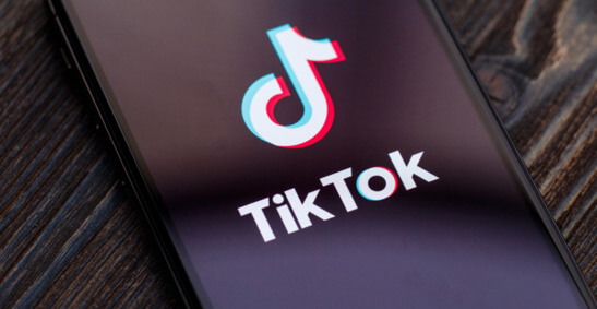 An image of the TikTok logo on a phone screen