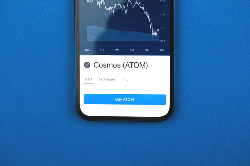 Cosmos Atom logo on a mobile phone screen