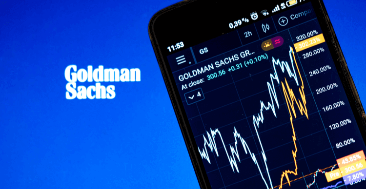 Het logo van Goldman Sachs met een aandelengrafiek