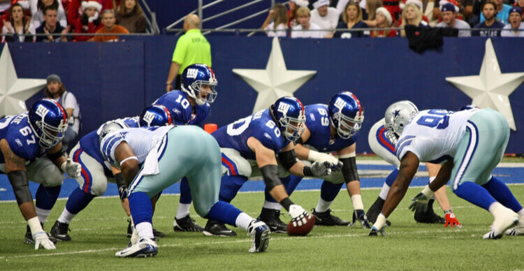 Foto van de New York Giants die tegen de Dallas Cowboys spelen