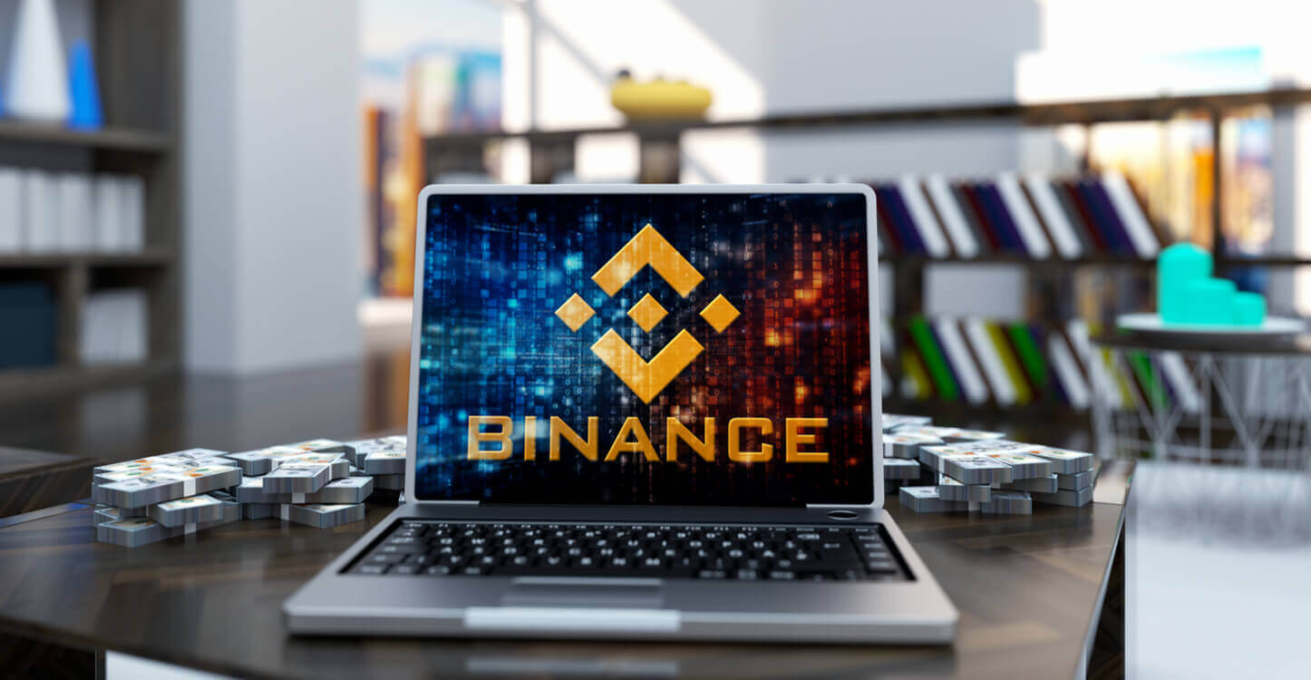 Foto van een laptop met het bedrijfslogo van Binance