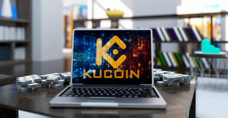 Foto van het KuCoin logo op een laptopscherm