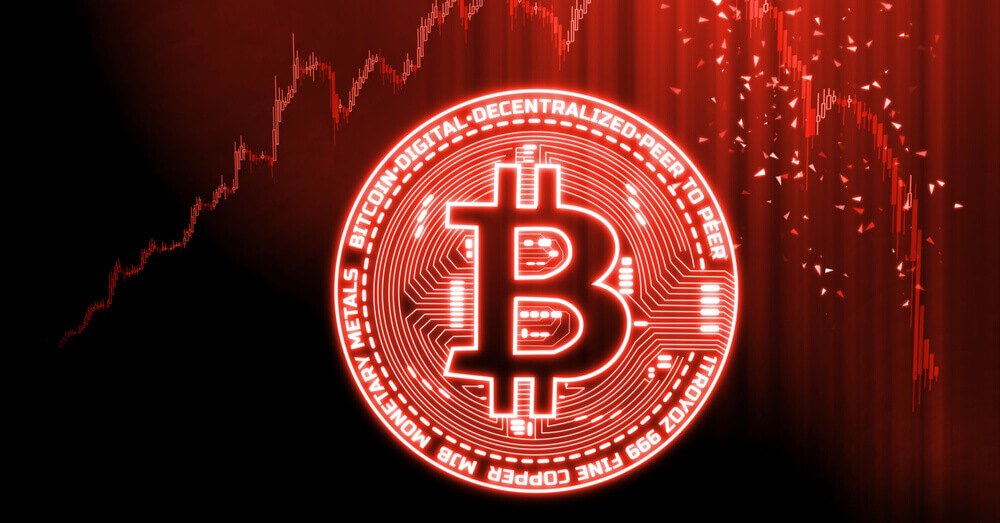 Une pièce Bitcoin rouge avec un graphique en baisse en arrière plan