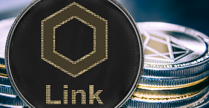 Une image du token ChainLink avec des crypto-monnaies empilées en arrière-plan