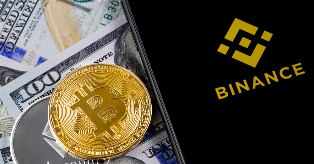 Une image du logo de Binance avec Bitcoin, Ethereum et US Dollar