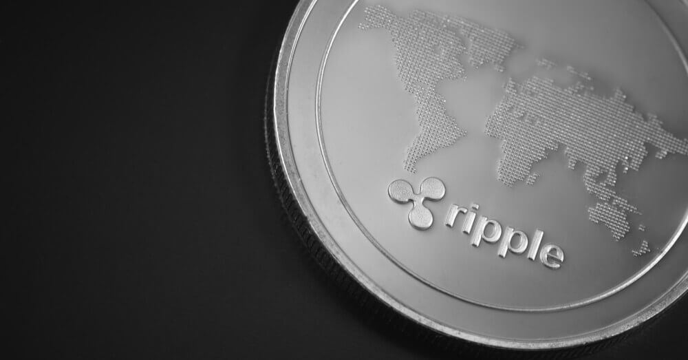 Image d’un coin Ripple avec une carte du monde sur le coin