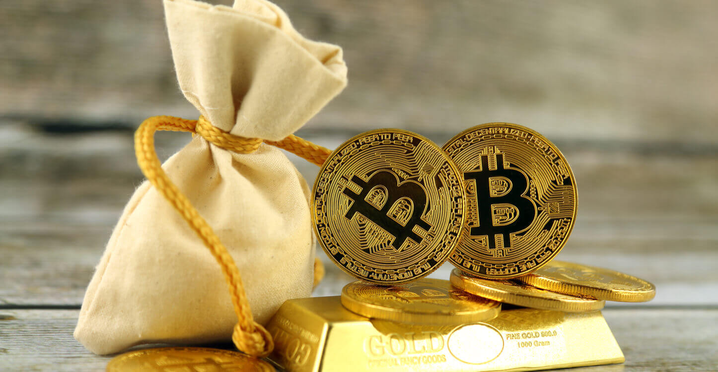 Une image de Bitcoins sur un lingot d'or