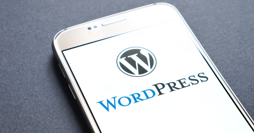 Une image de l'écran d'un smartphone montrant le logo WordPress