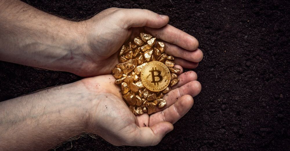 Ein Bitcoin-Miner mit Gold Nuggets