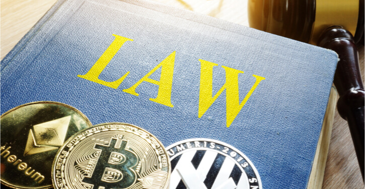 Cryptocurrency coins and law book