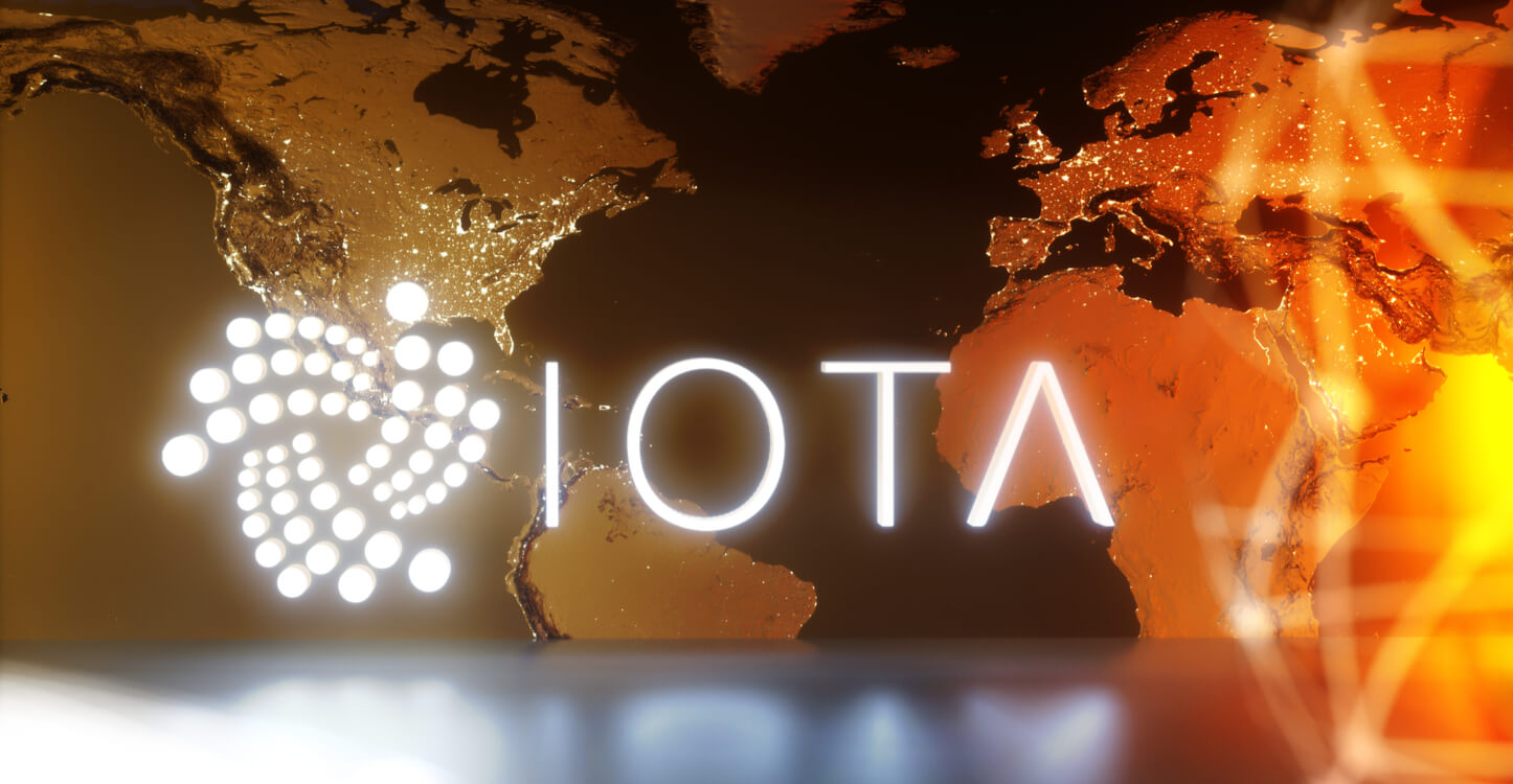 IOTA logo in front of the world map