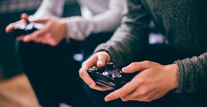 Two gamers playing on an Xbox