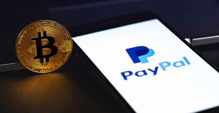 Image of PayPal app on a smartphone next to a Bitcoin